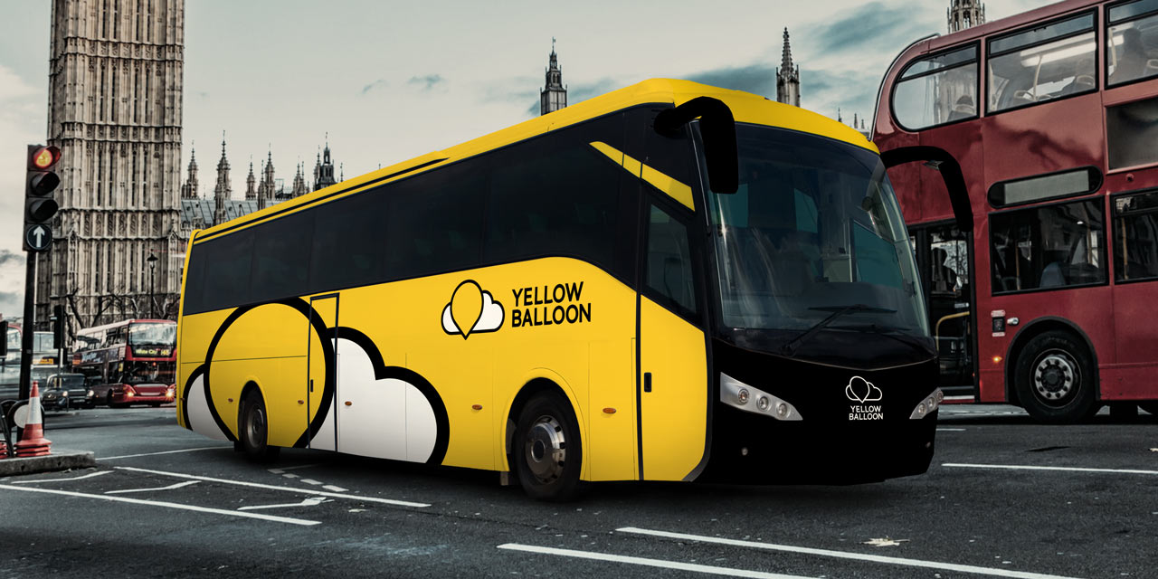Yellow Balloon branded coach in yellow